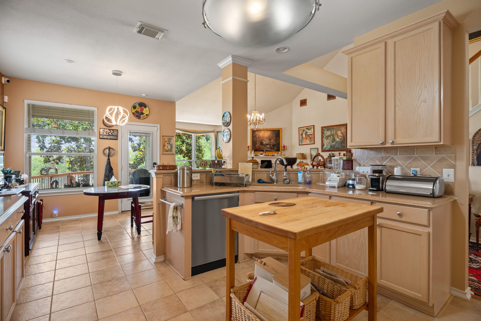 Open kitchen with vaulted ceilings in a managed San Antonio rental